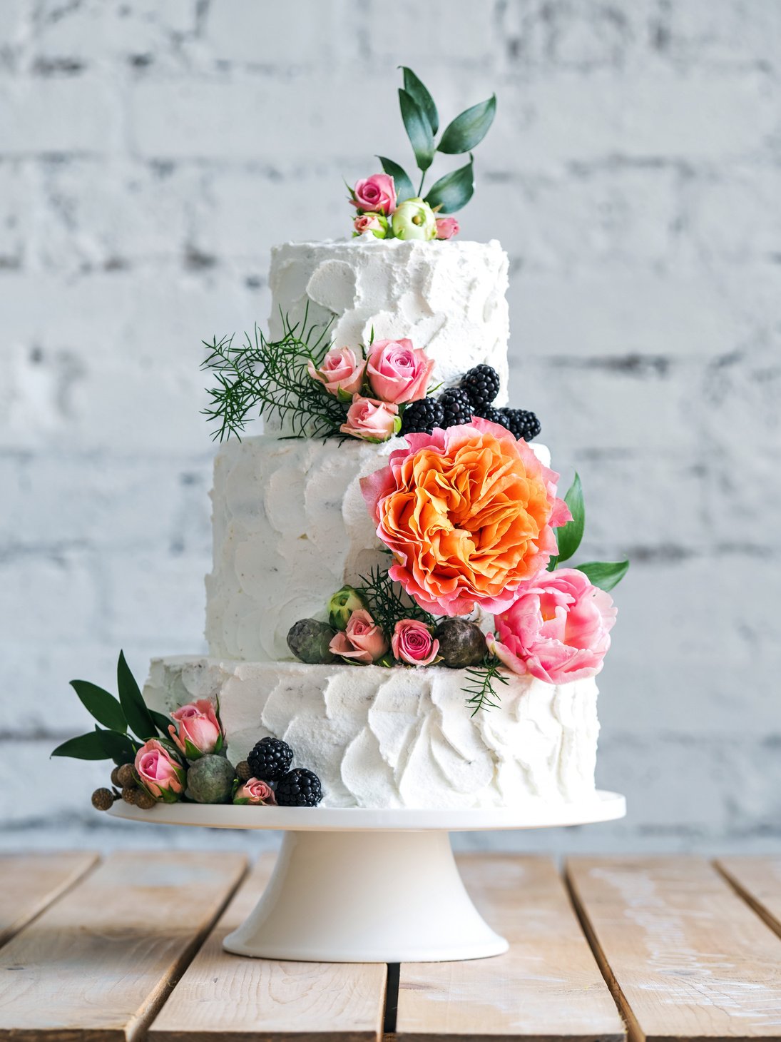 White wedding cake with flowers